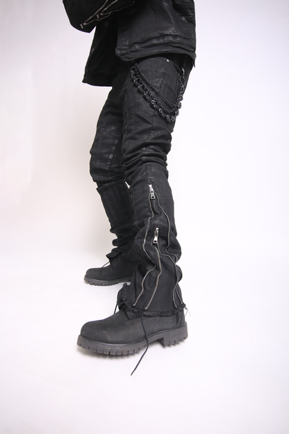 Black leather boots and pants on a white background