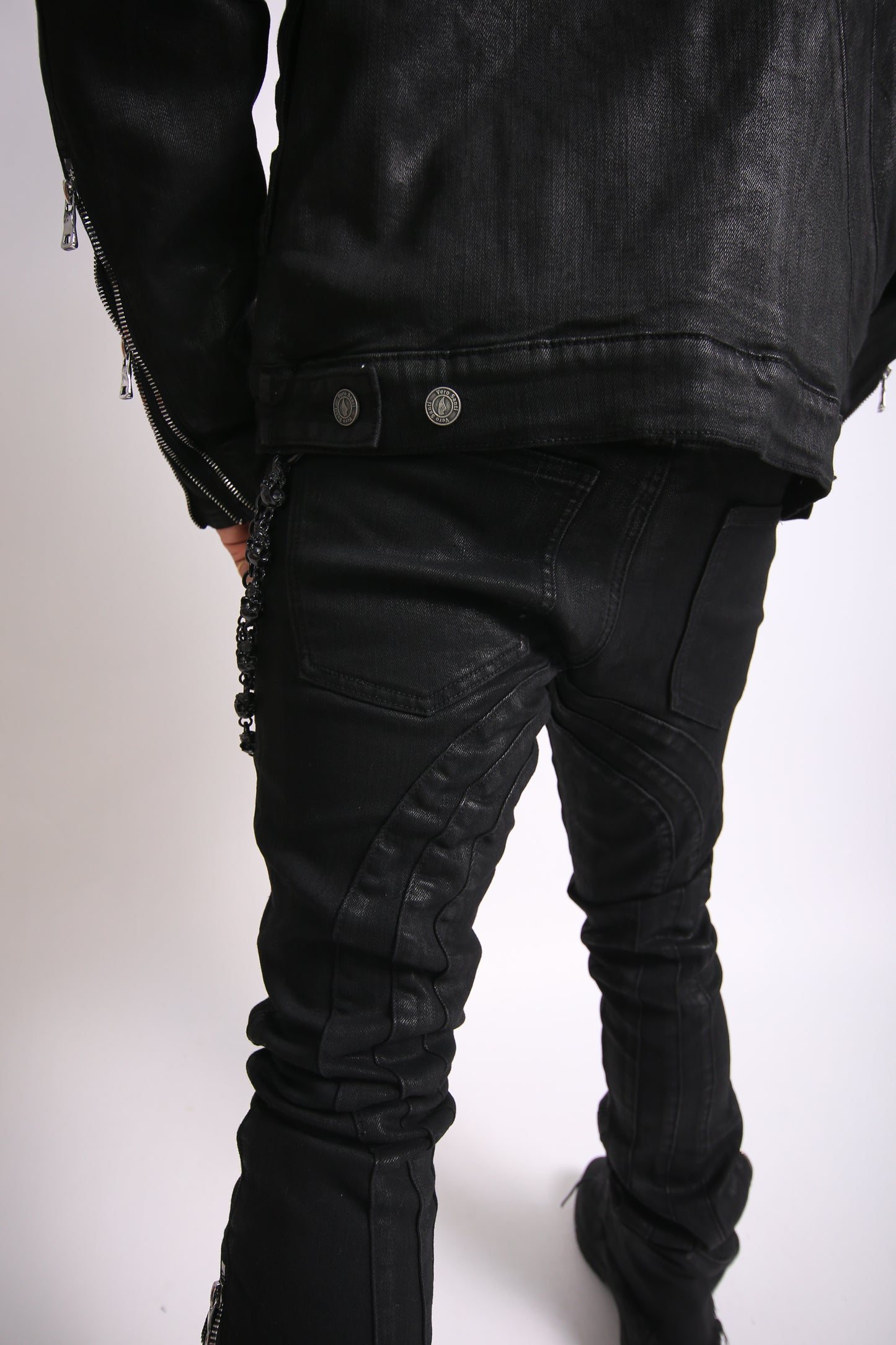 Black leather jacket displayed on a white background