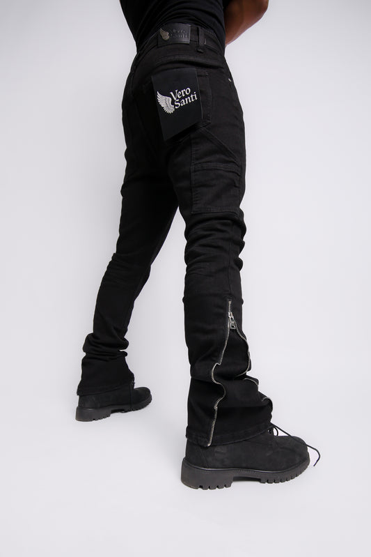 Person wearing black pants with a brand logo on a white background