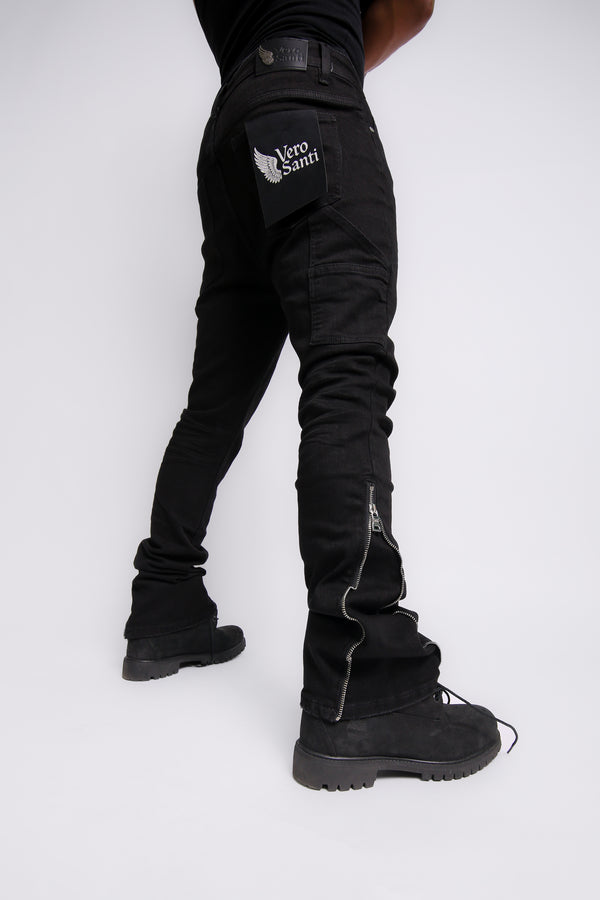 Person wearing black pants with a brand logo on a white background
