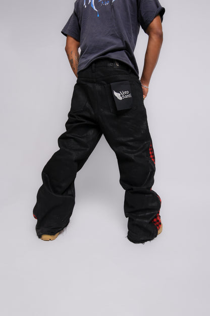 Person wearing black pants with a Vero Santi logo on a white background