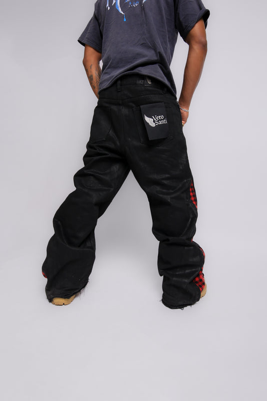 Person wearing black pants with a Vero Santi logo on a white background