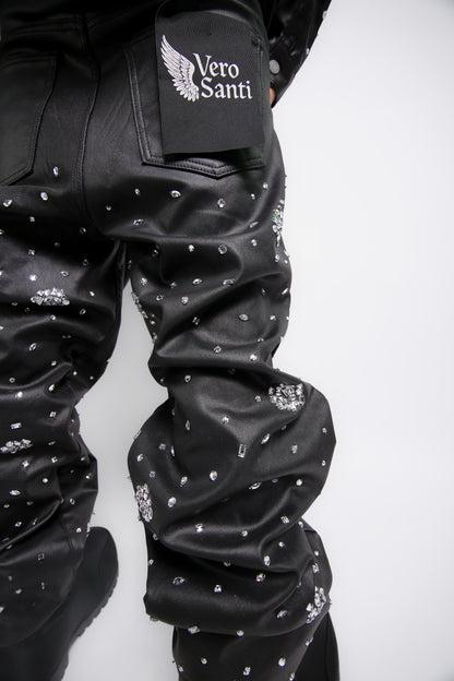 Black leather jacket with rhinestone embellishments and 'Vero Santi' logo on sleeve against a white background